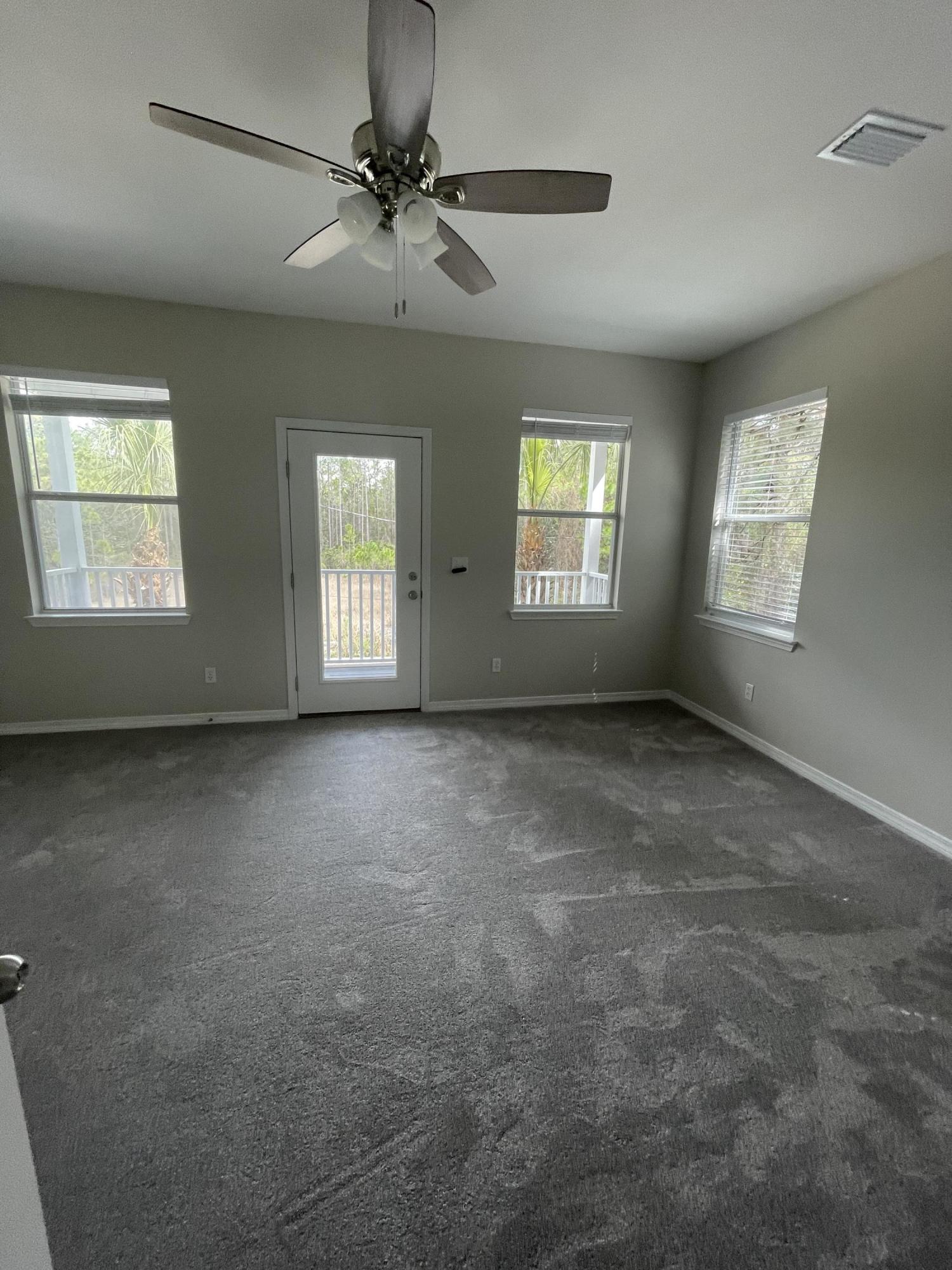 47 15th Street Santa Rosa Beach, FL 32459 - Photo 8 of 20 a view of an empty room with a window