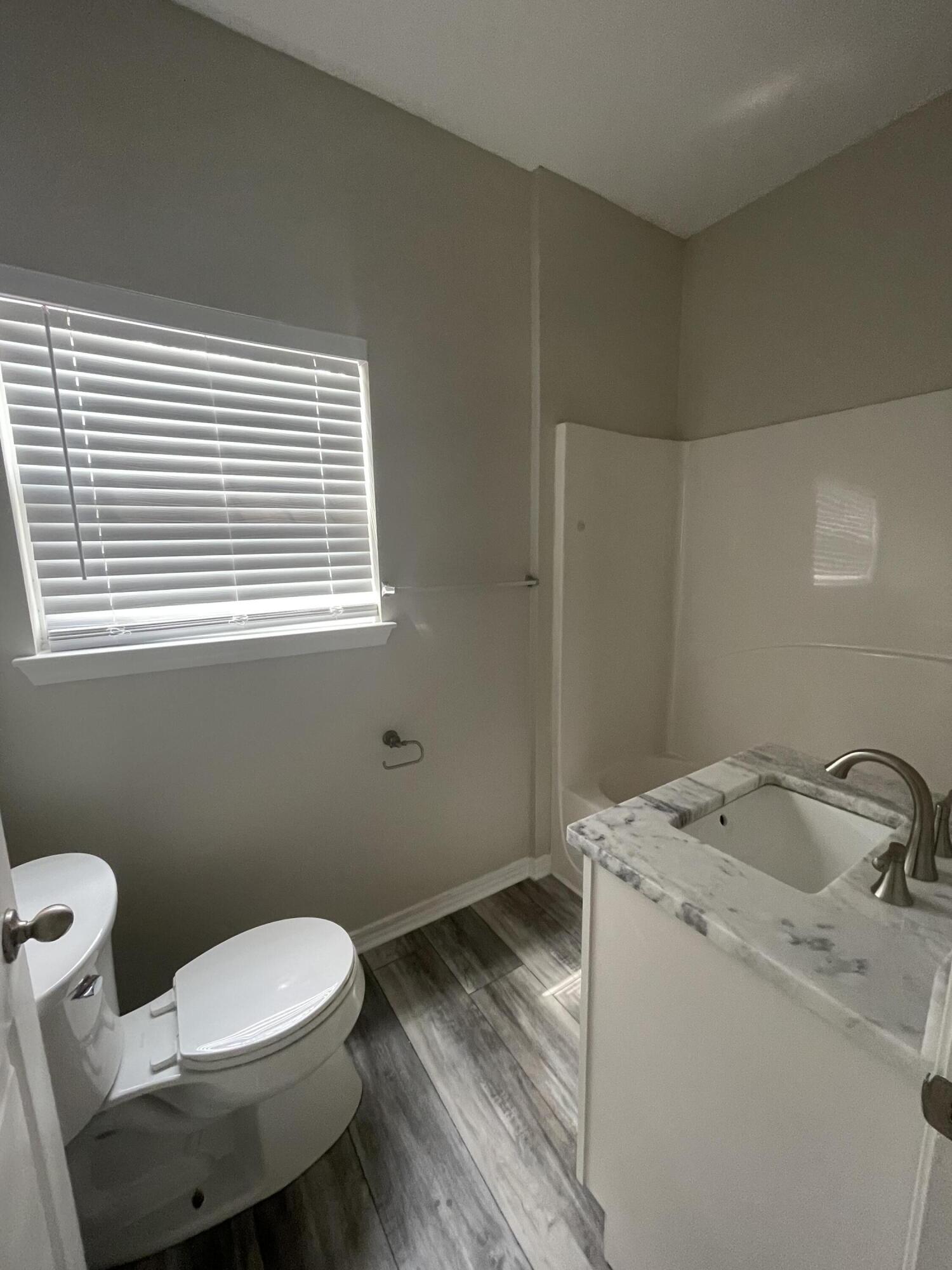 47 15th Street Santa Rosa Beach, FL 32459 - Photo 10 of 20 a bathroom with a sink and a toilet