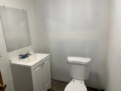 a view of a room with a wooden cabinets