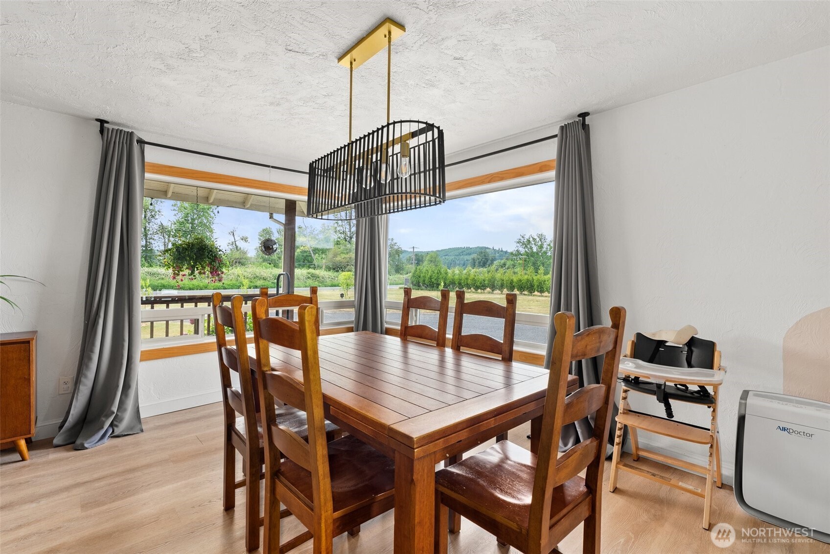 953 Boistfort Road Curtis, WA 98538 - Photo 12 of 40 a view of a dining room with furniture window and wooden floor
