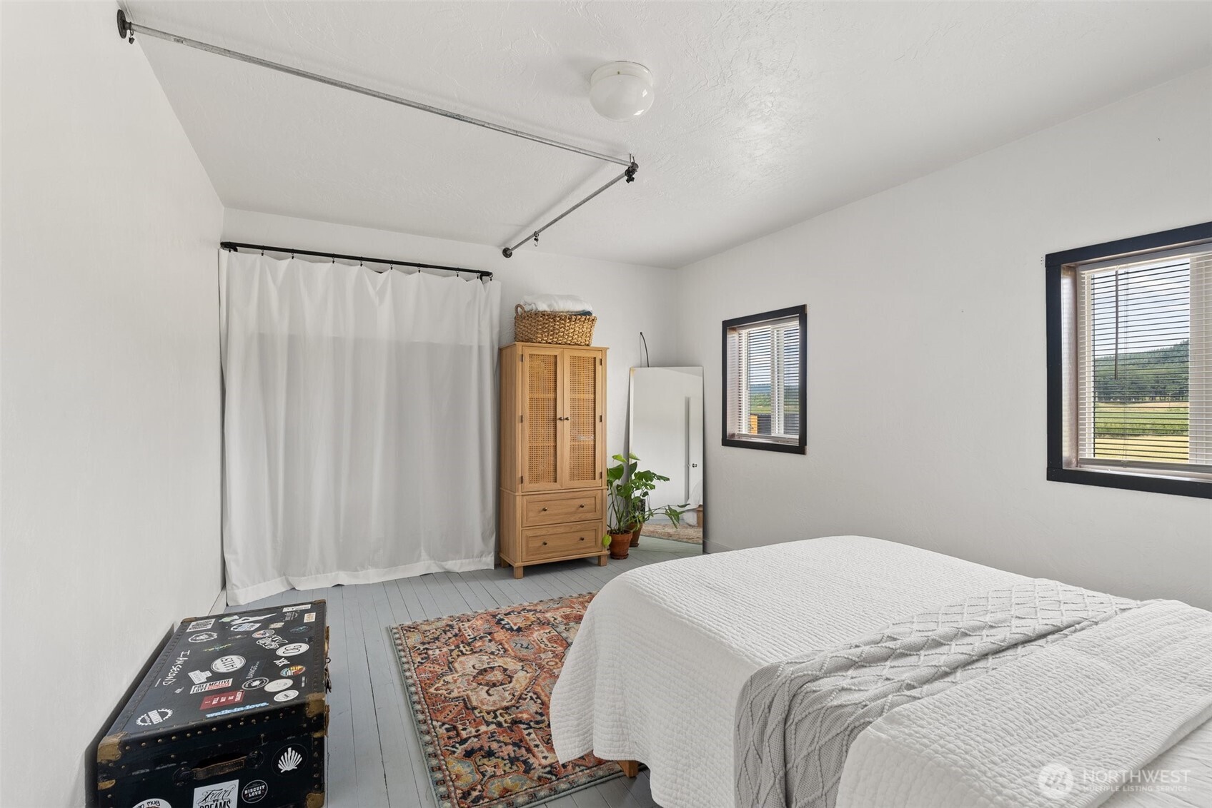 953 Boistfort Road Curtis, WA 98538 - Photo 19 of 40 a bedroom with a bed and a window