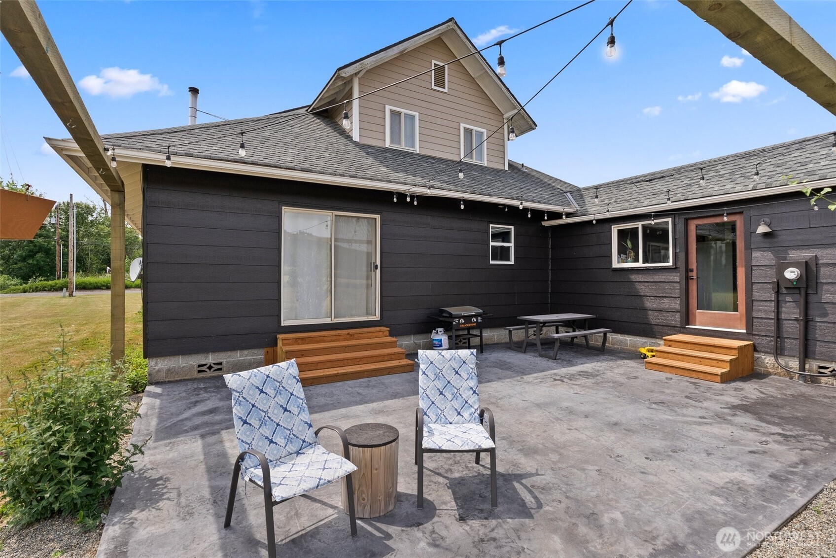 953 Boistfort Road Curtis, WA 98538 - Photo 26 of 40 a backyard of a house with wooden chairs and wooden fence