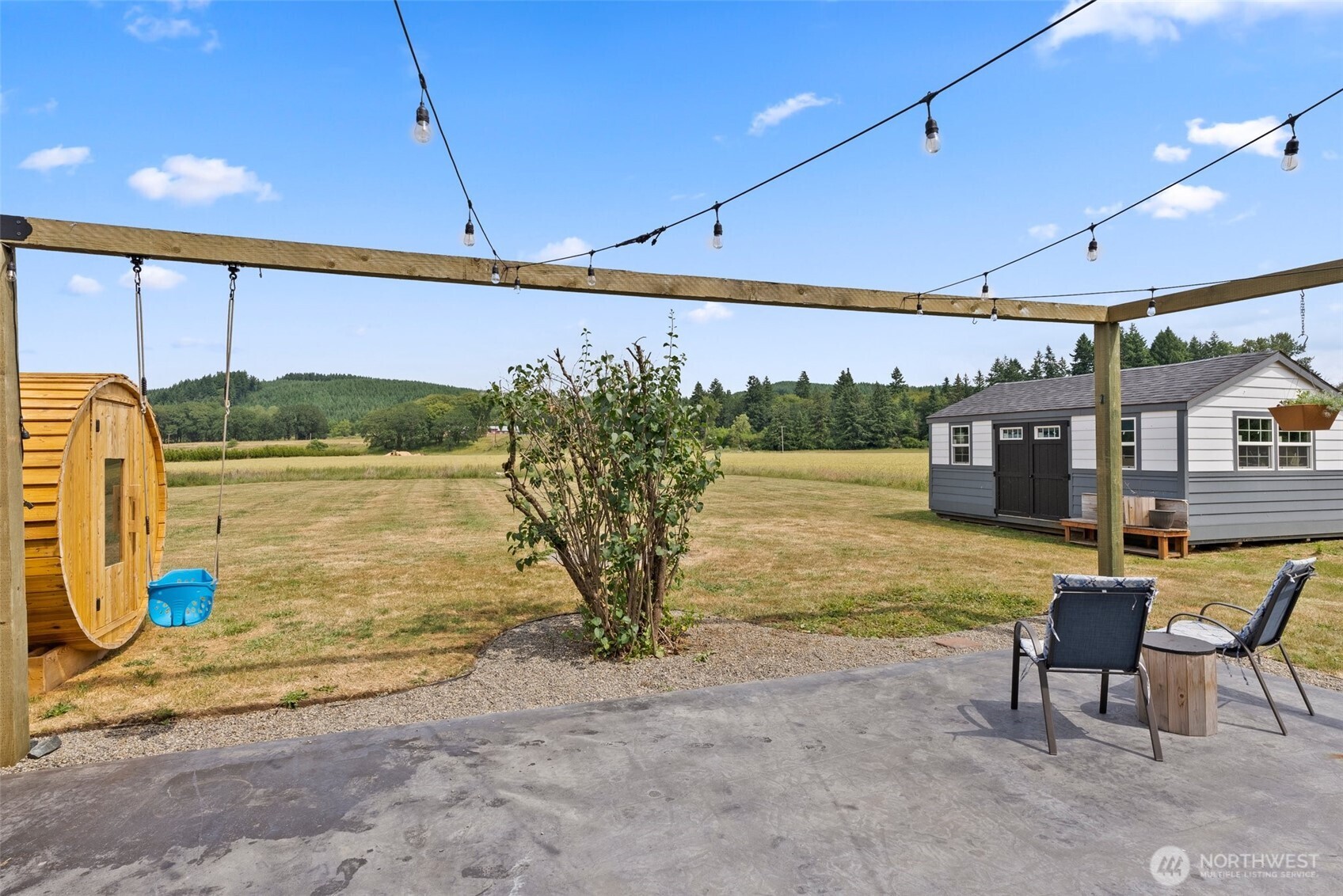 953 Boistfort Road Curtis, WA 98538 - Photo 27 of 40 a view of a patio with table and chairs potted plants