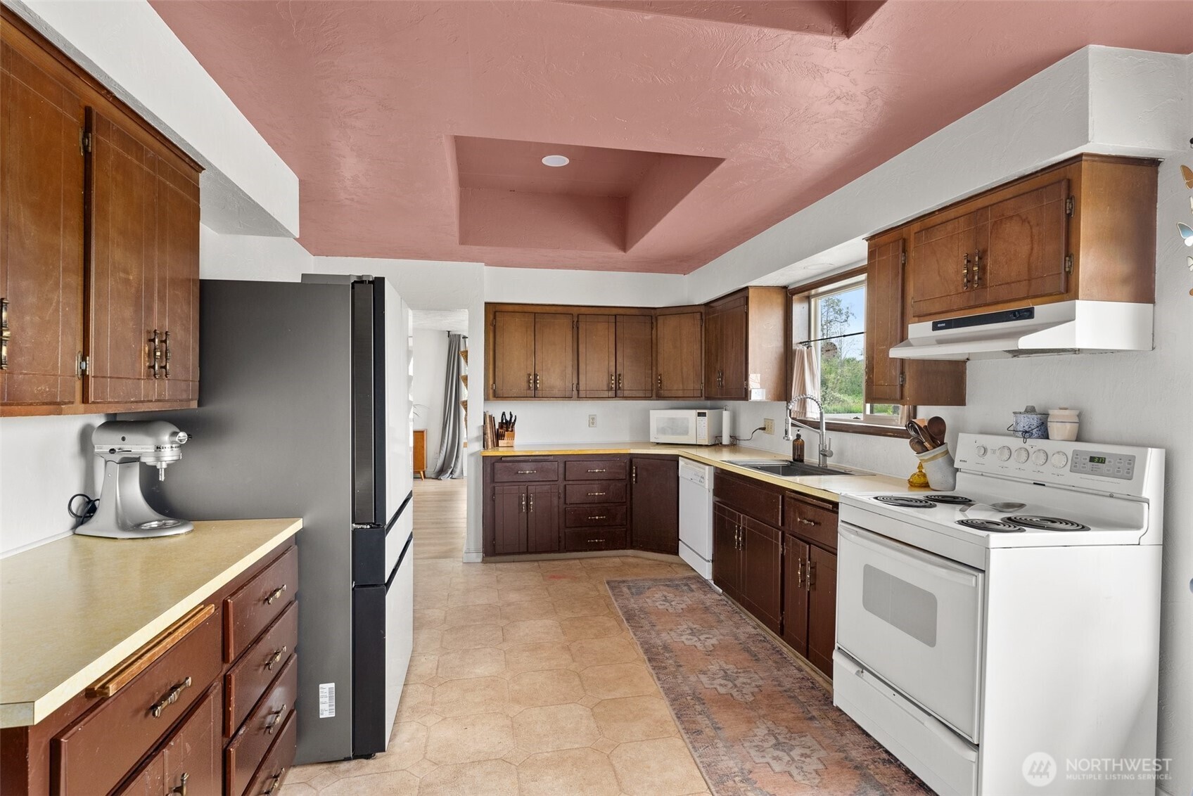 953 Boistfort Road Curtis, WA 98538 - Photo 9 of 40 a kitchen with a sink stove and refrigerator