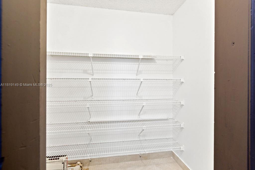 850 North Miami Avenue, Unit W1001 Miami, FL 33136 - Photo 11 of 30 a view of a room with shelves