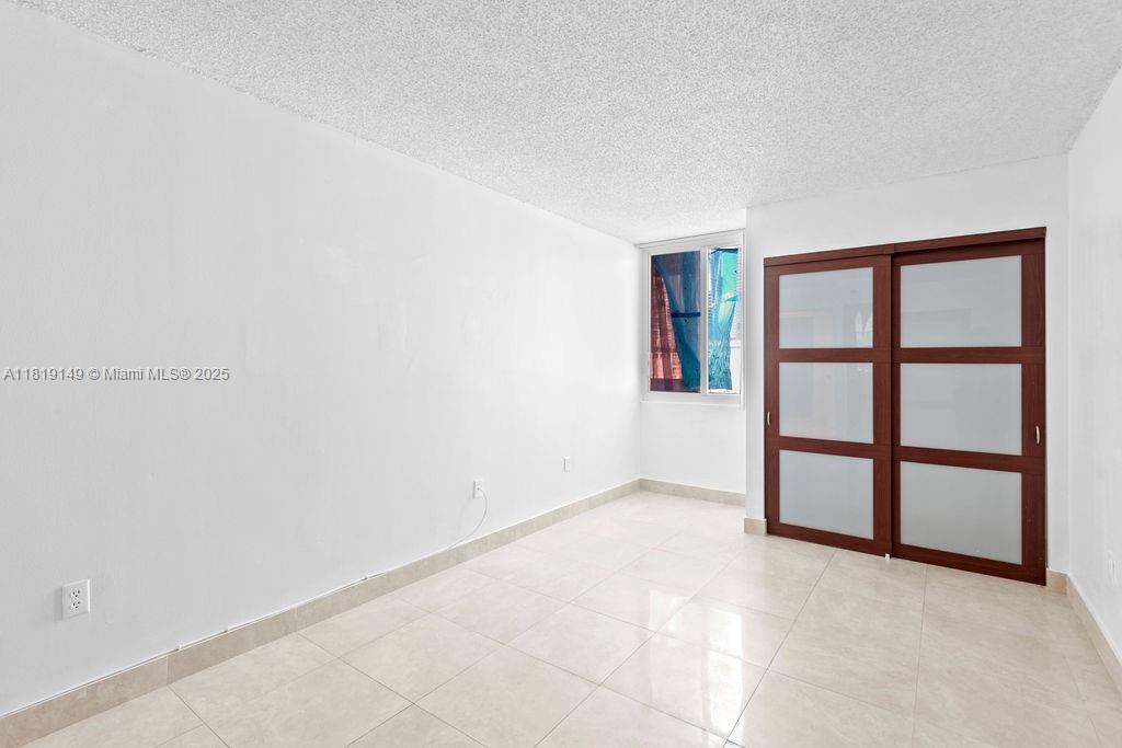 850 North Miami Avenue, Unit W1001 Miami, FL 33136 - Photo 14 of 30 an empty room with a window