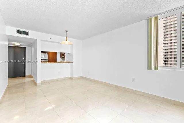 a view of a big room with windows and cabinet