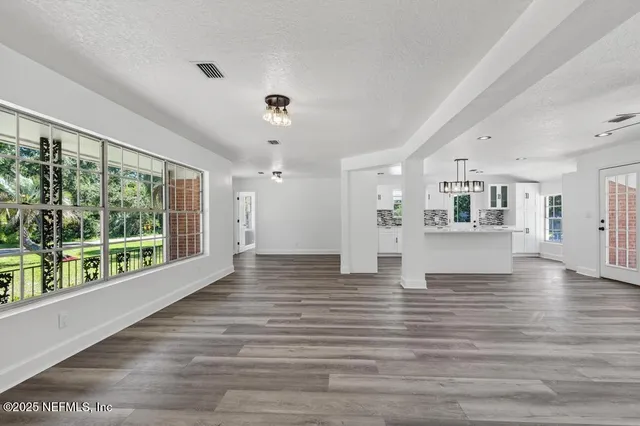 a bathroom with double vanity sink and mirror
