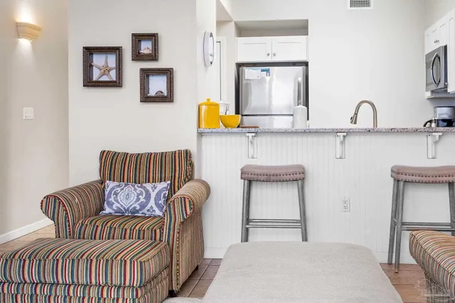 a kitchen with a sink appliances and a counter top space