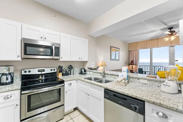 a kitchen with a stove and a microwave