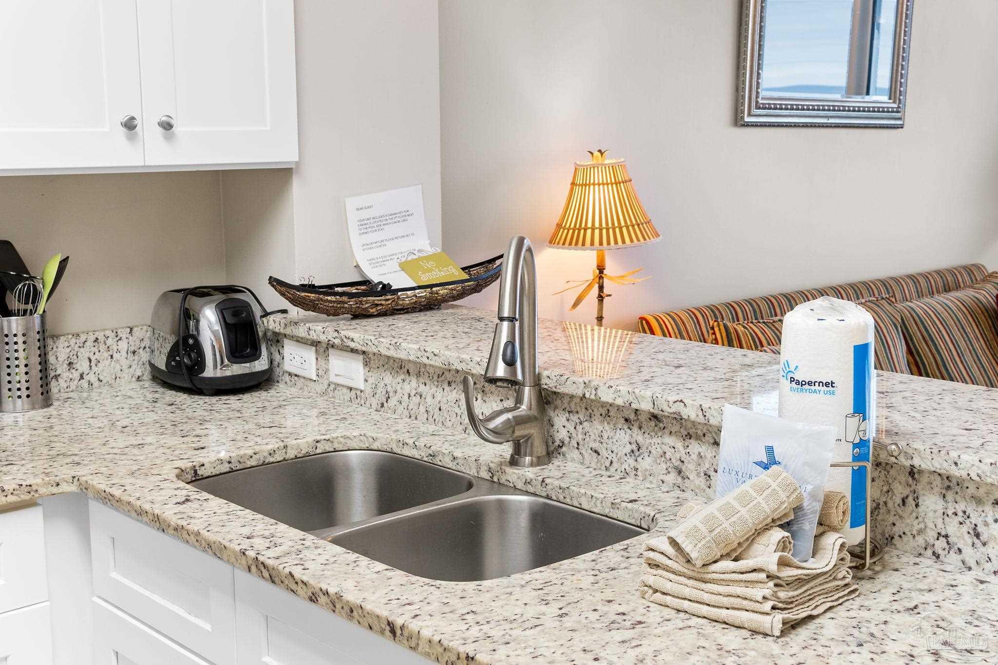 14511 Perdido Key Drive, Unit 904 Perdido Key, FL 32507 - Photo 15 of 64 a kitchen with a sink and a stove top oven