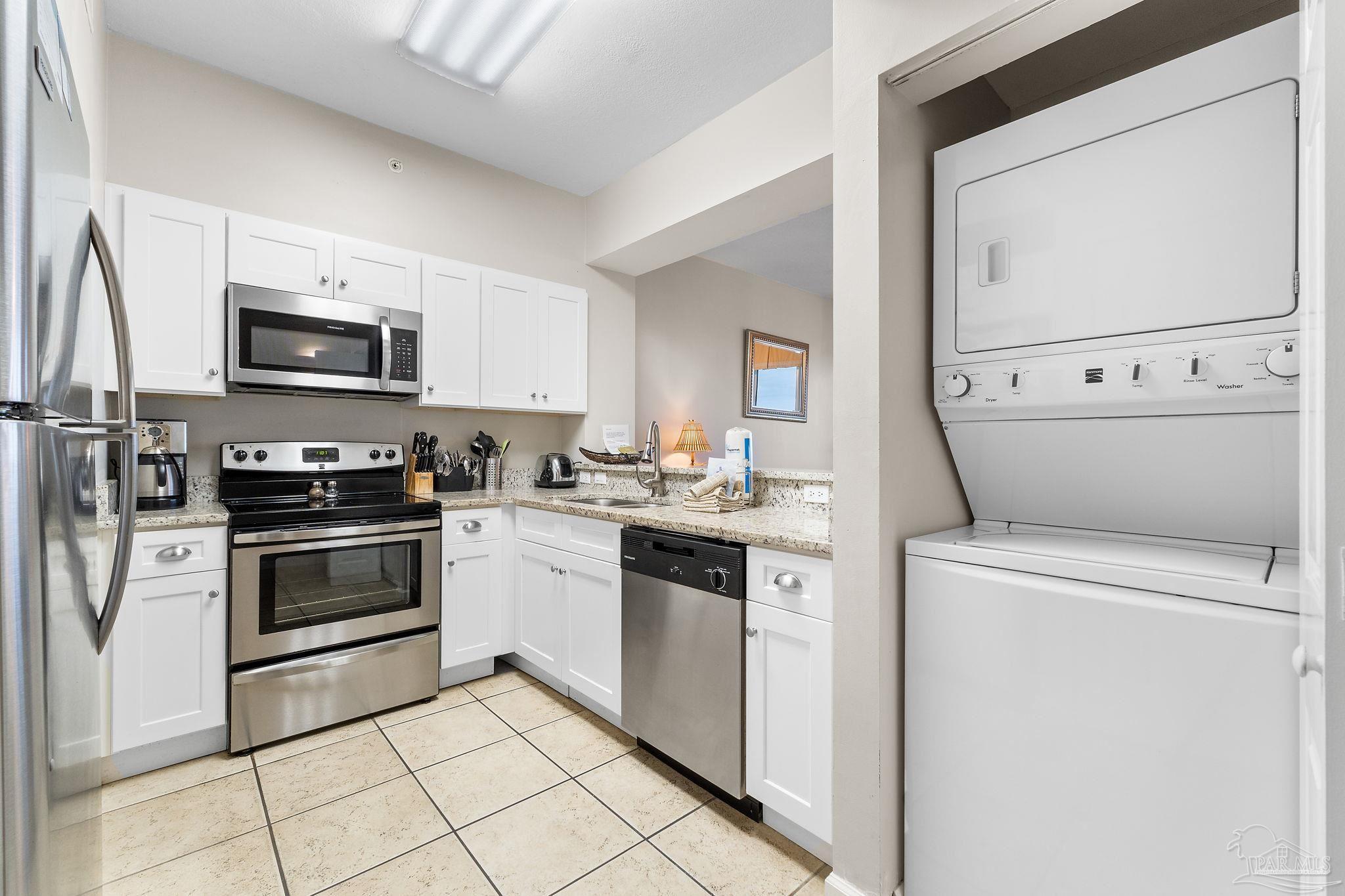 14511 Perdido Key Drive, Unit 904 Perdido Key, FL 32507 - Photo 17 of 64 a kitchen with a stove and a microwave