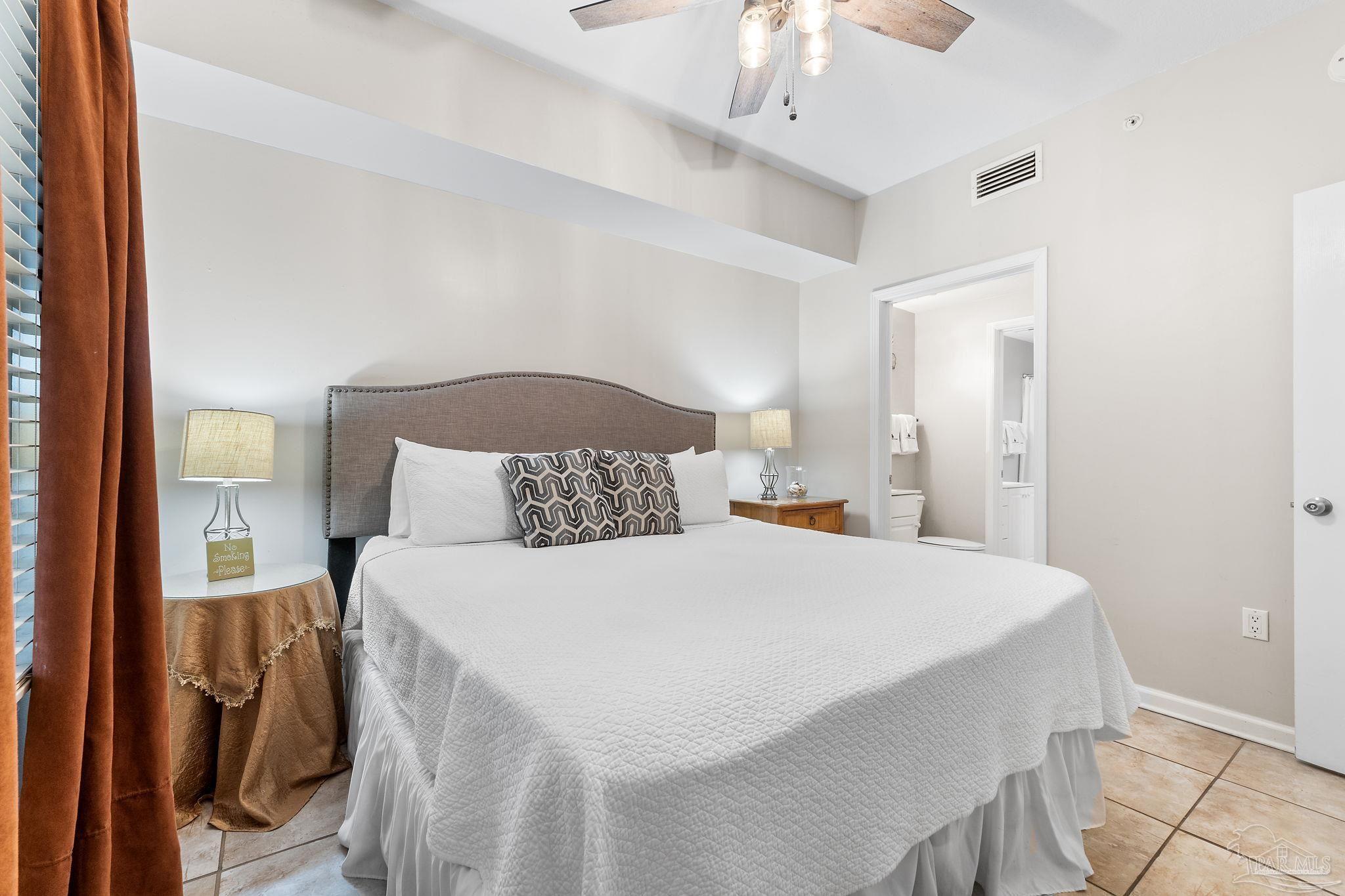 14511 Perdido Key Drive, Unit 904 Perdido Key, FL 32507 - Photo 24 of 64 a bedroom with a bed and a chandelier