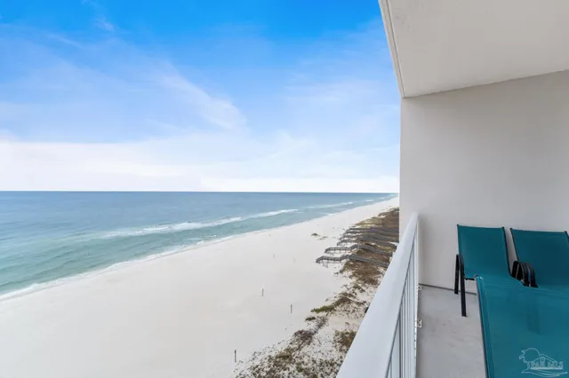 a living room with furniture a flat screen tv and a window