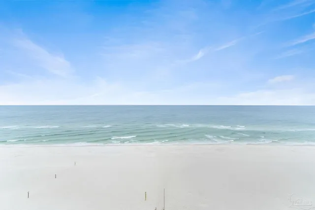 a utility room with cabinets washer and dryer