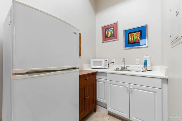 a view of a livingroom with a cycle and more windows