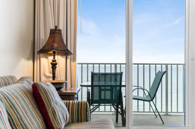 a view of a kitchen with furniture and a window