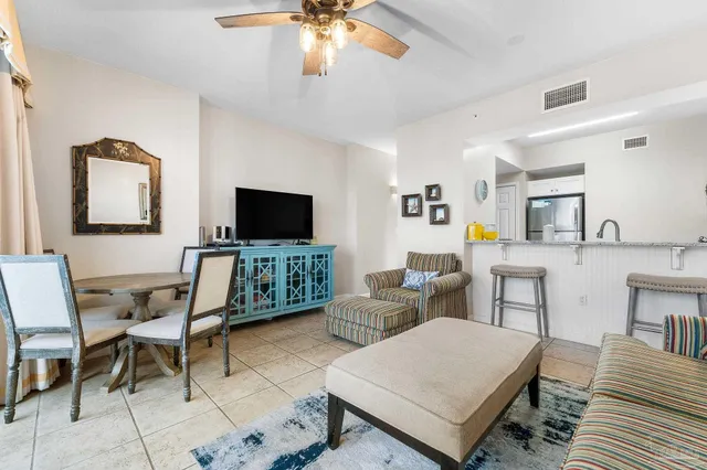 a view of a dining room with furniture and a window