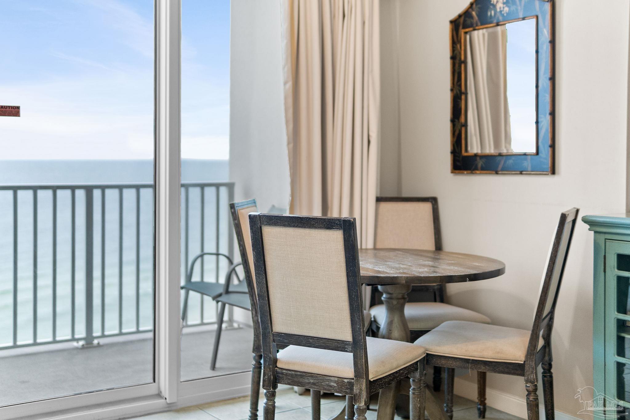 14511 Perdido Key Drive, Unit 904 Perdido Key, FL 32507 - Photo 7 of 64 a view of a dining room with furniture and a window