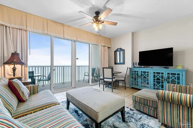 a view of a dining room with furniture and a window