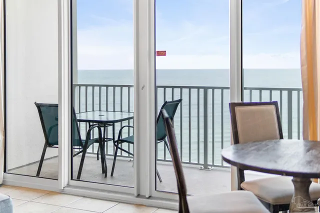 a bedroom with furniture and a mirror