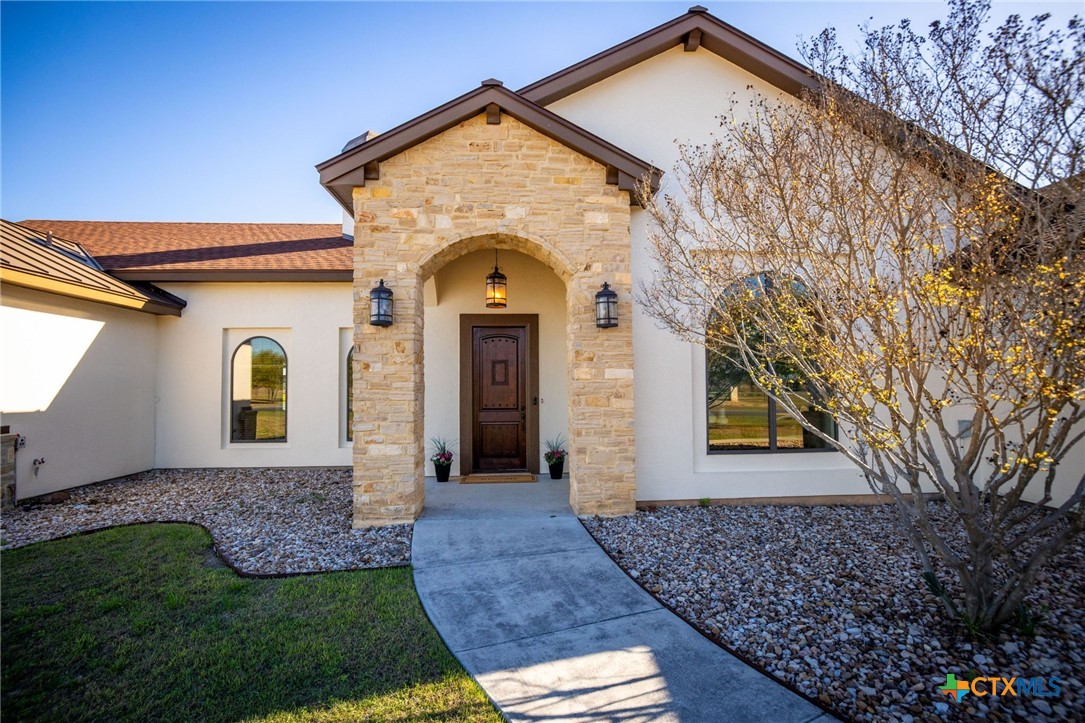 925 River Ranch Circle Martindale, TX 78655 - Photo 3 of 48 a front view of a house with garden