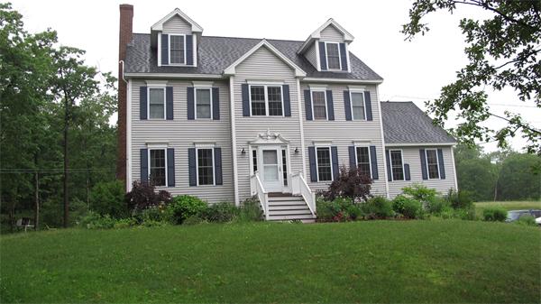 160 Barker Hill Road Townsend, MA 01469 - Photo 1 of 29 a front view of a house with a yard and trees