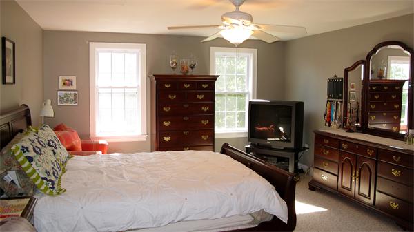 160 Barker Hill Road Townsend, MA 01469 - Photo 19 of 29 a bedroom with a bed and a flat tv screen on the dresser