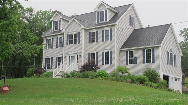 160 Barker Hill Road Townsend, MA 01469 - Photo 2 of 29 a front view of a house with a yard