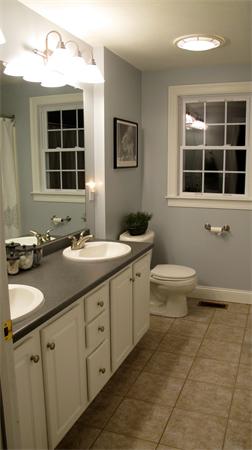 160 Barker Hill Road Townsend, MA 01469 - Photo 23 of 29 a bathroom with a double vanity sink a large mirror and a window