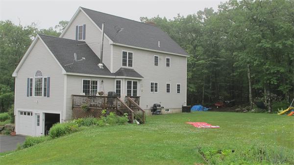 160 Barker Hill Road Townsend, MA 01469 - Photo 29 of 29 a aerial view of a house next to a big yard and large trees