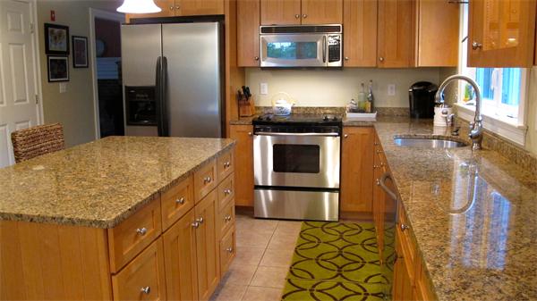160 Barker Hill Road Townsend, MA 01469 - Photo 4 of 29 a kitchen with stainless steel appliances granite countertop a stove a sink and a microwave
