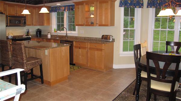160 Barker Hill Road Townsend, MA 01469 - Photo 6 of 29 a kitchen that has a sink a table and chairs in it