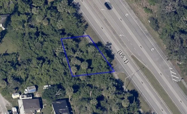 a view of a street with a bench