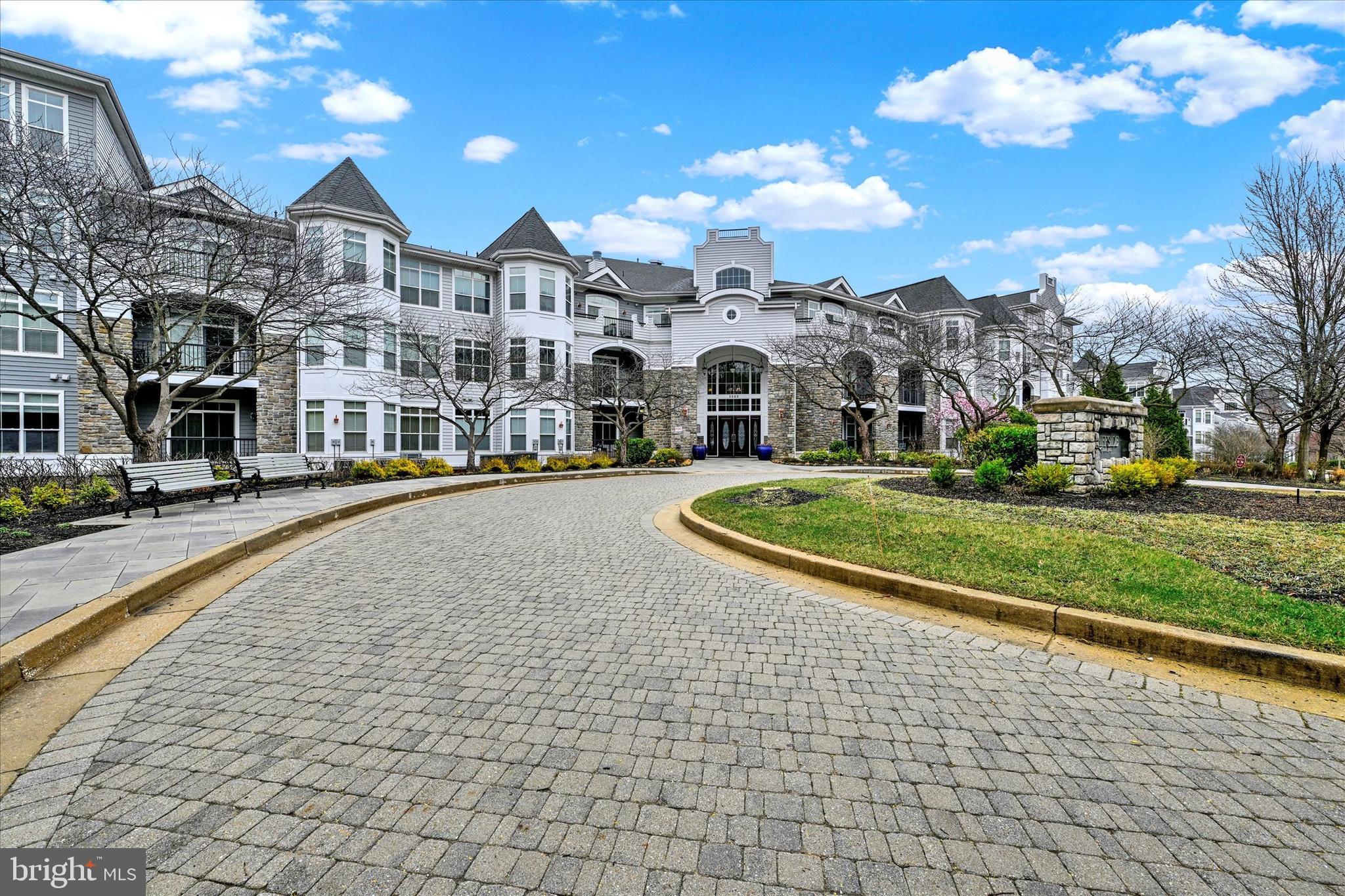 3000 Stone Cliff Drive, Unit 205 Baltimore, MD 21209 - Photo 2 of 28 a view of multiple houses with a yard
