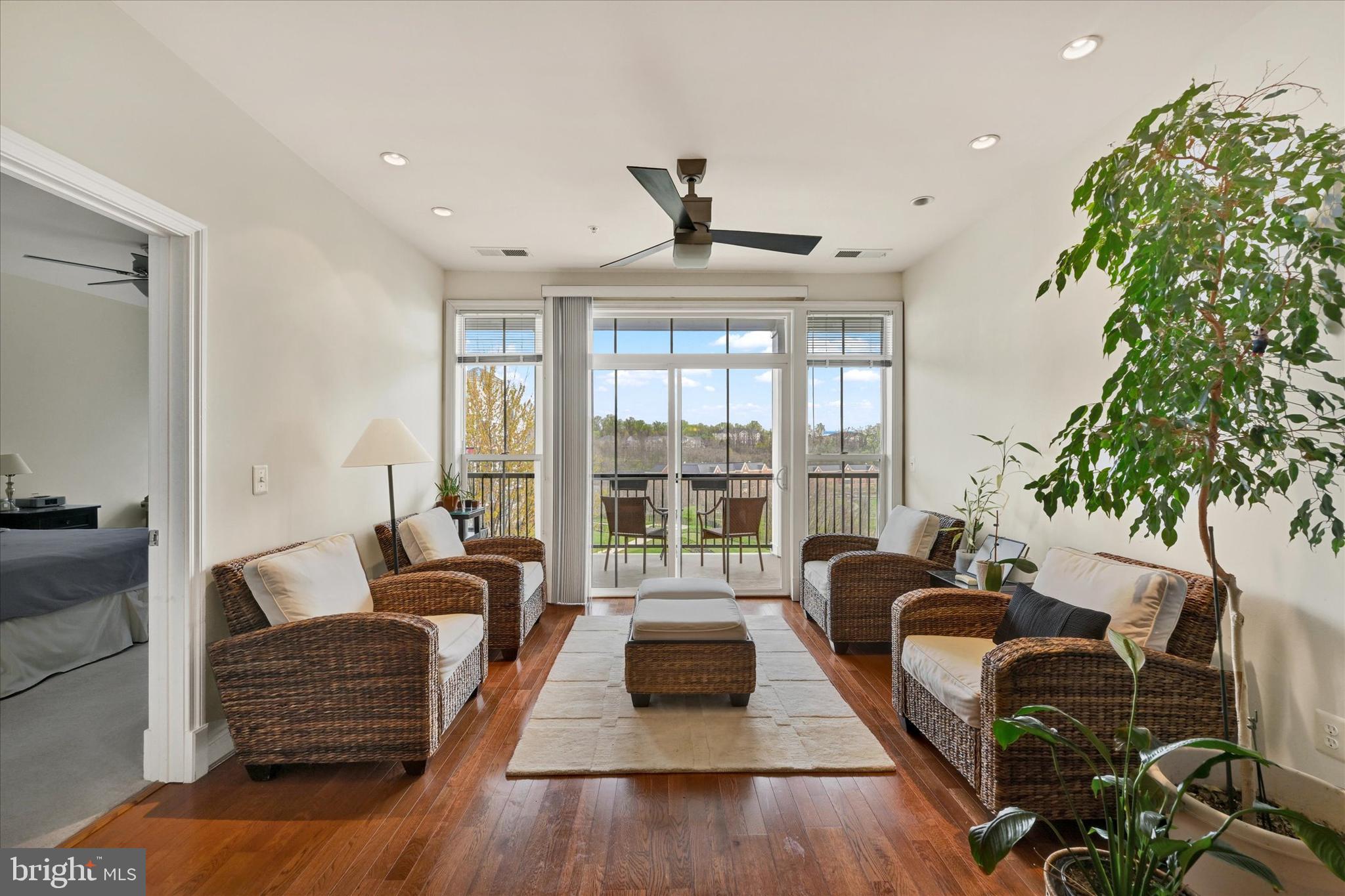 3000 Stone Cliff Drive, Unit 205 Baltimore, MD 21209 - Photo 5 of 28 a living room with furniture and a large window