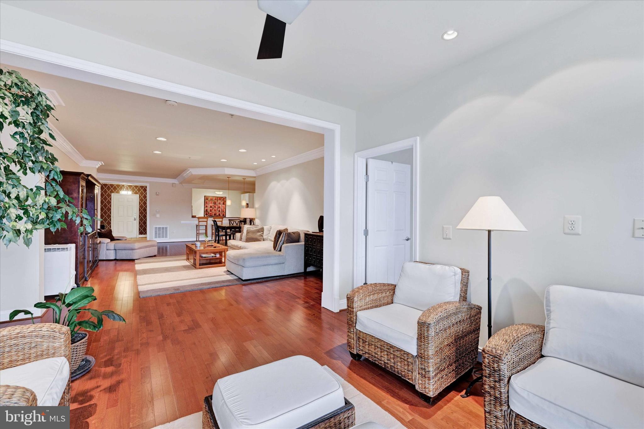 3000 Stone Cliff Drive, Unit 205 Baltimore, MD 21209 - Photo 7 of 28 a living room with furniture and a lamp