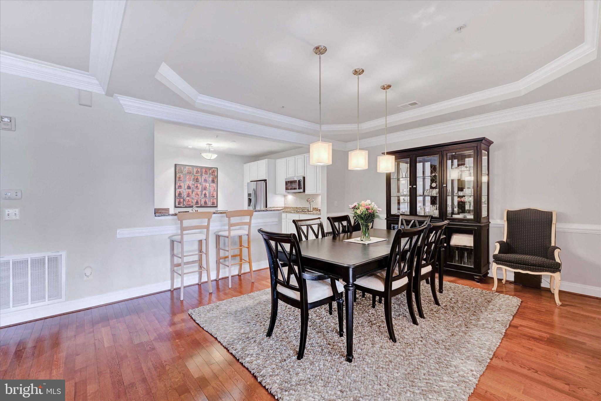 3000 Stone Cliff Drive, Unit 205 Baltimore, MD 21209 - Photo 9 of 28 a view of a a dining room with furniture window and wooden floor
