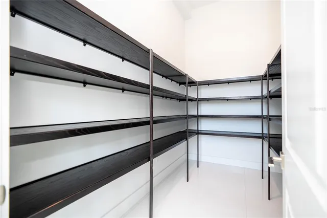 a kitchen with cabinets and window