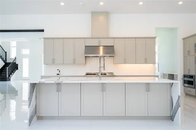 a house with swimming pool in front of it