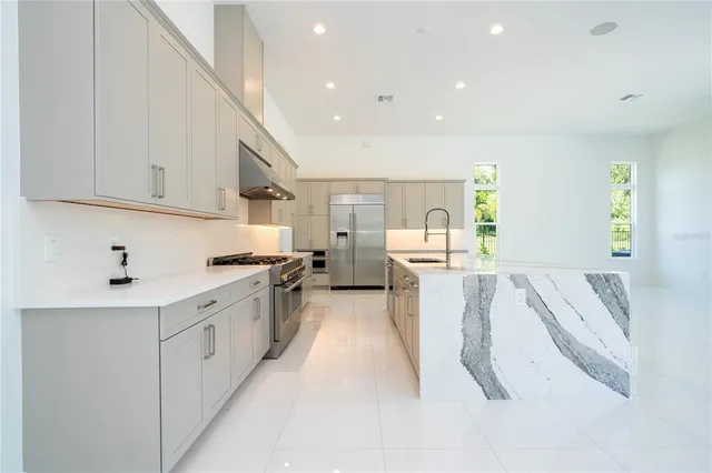 a view of a big room with wooden floor and garden