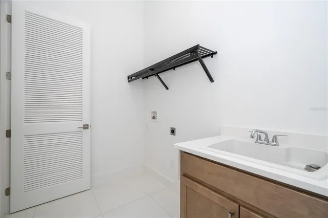 a view of a livingroom with wooden floor and stairs