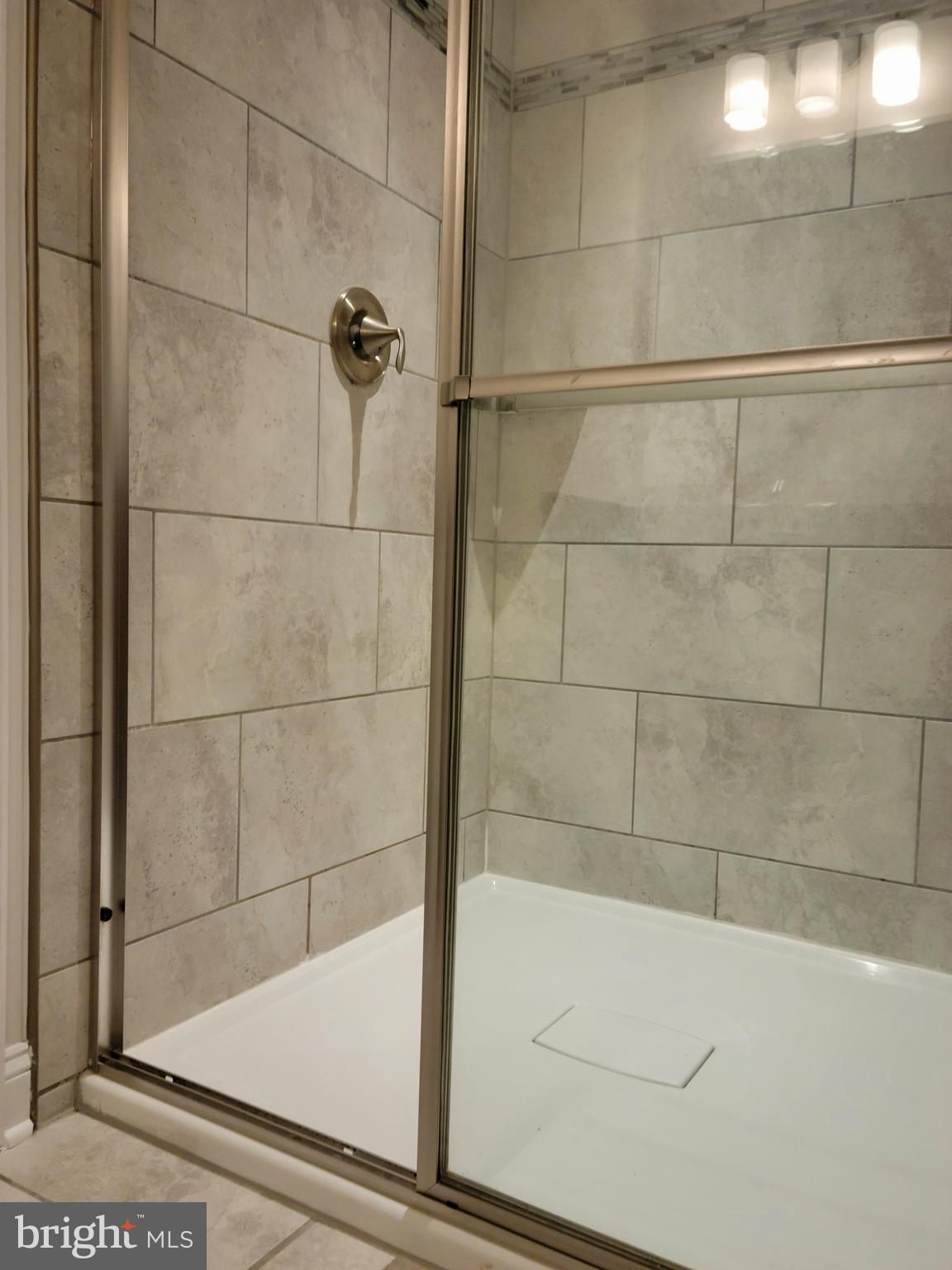 7111 Tyndale Way Hanover, MD 21076 - Photo 24 of 59 Primary bath with walk in shower with seat