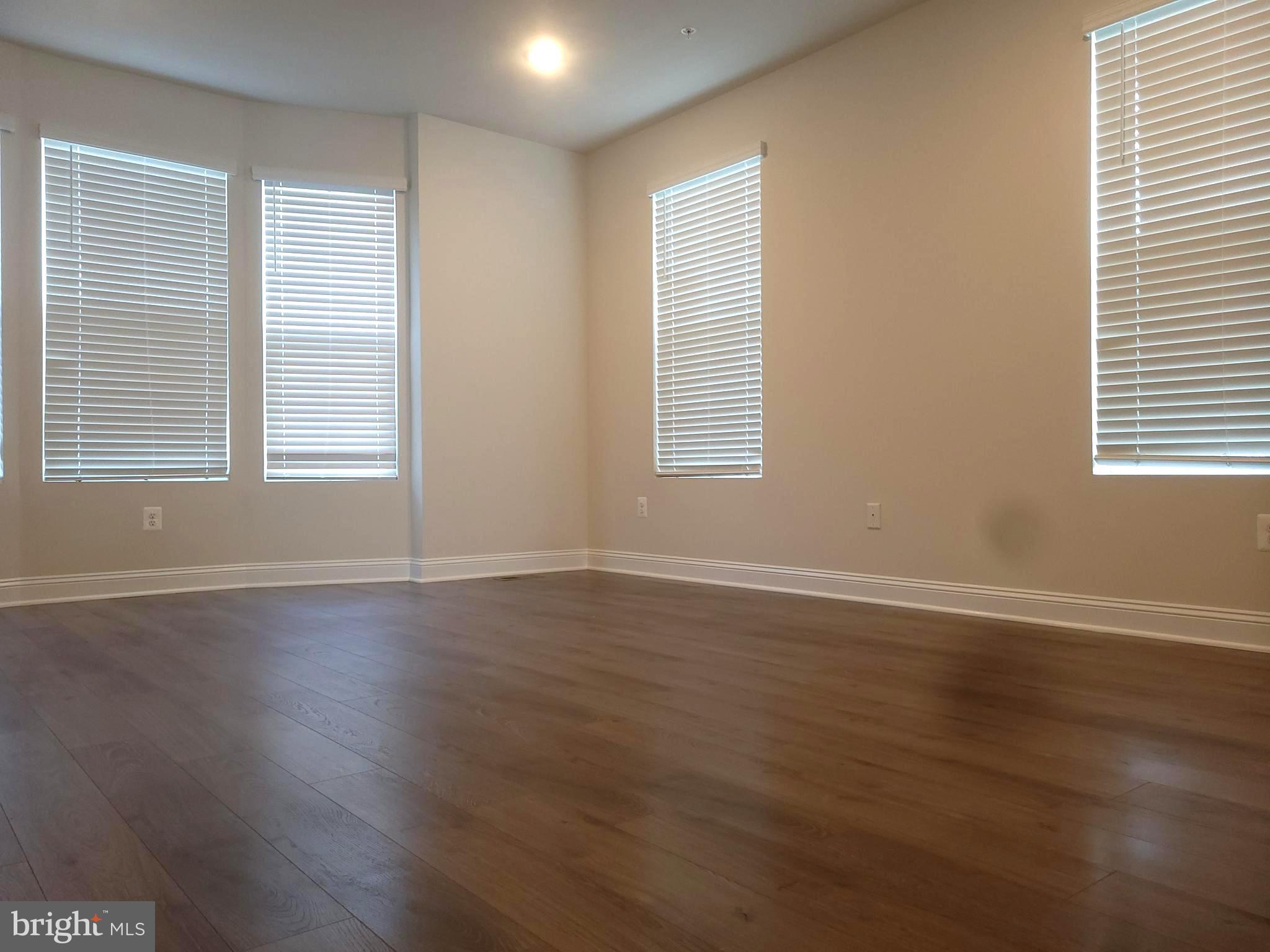7111 Tyndale Way Hanover, MD 21076 - Photo 3 of 59 Living room, with luxury vinyl plank floors