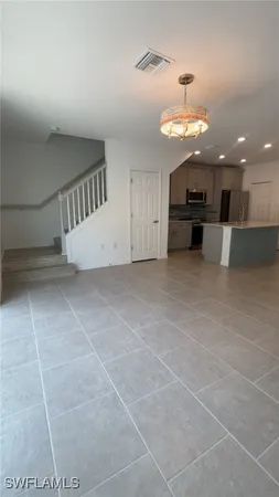 a view of a kitchen with a sink and cabinets