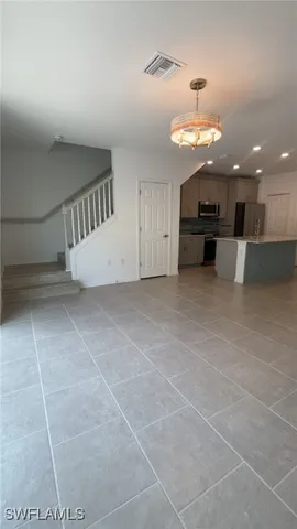 a view of a kitchen with a sink and cabinets