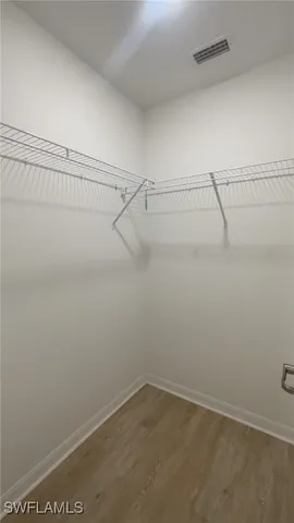 a bathroom with a double vanity sink and mirror