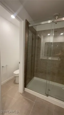 a view of hallway with wooden floor