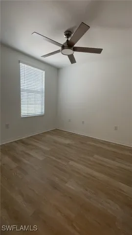 en empty room with wooden floor