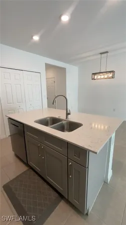 a kitchen with a sink and cabinets